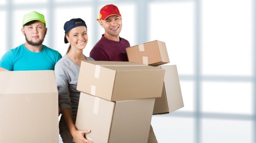 Removal team handling furniture near Eltham homes