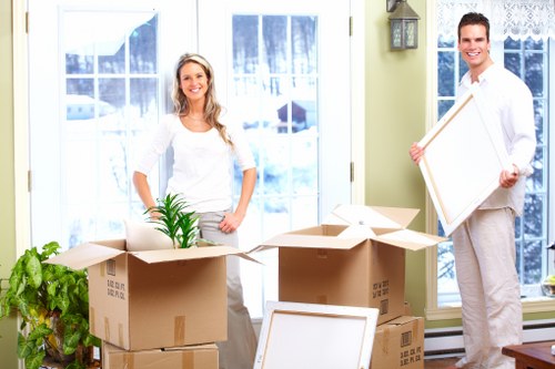 Loading boxes and furniture into a removal truck in Eltham